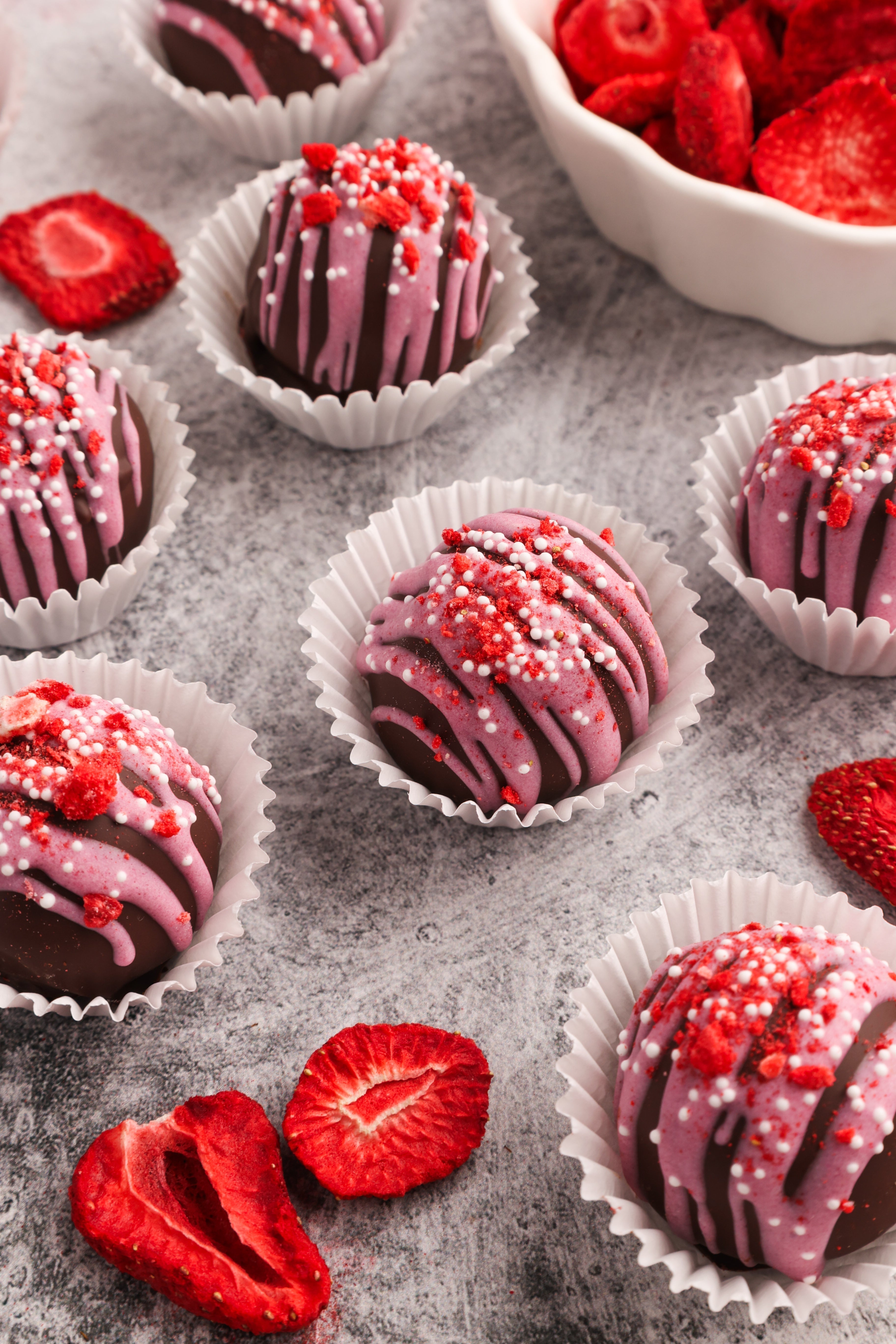 Chocolate truffles with pink drizzle