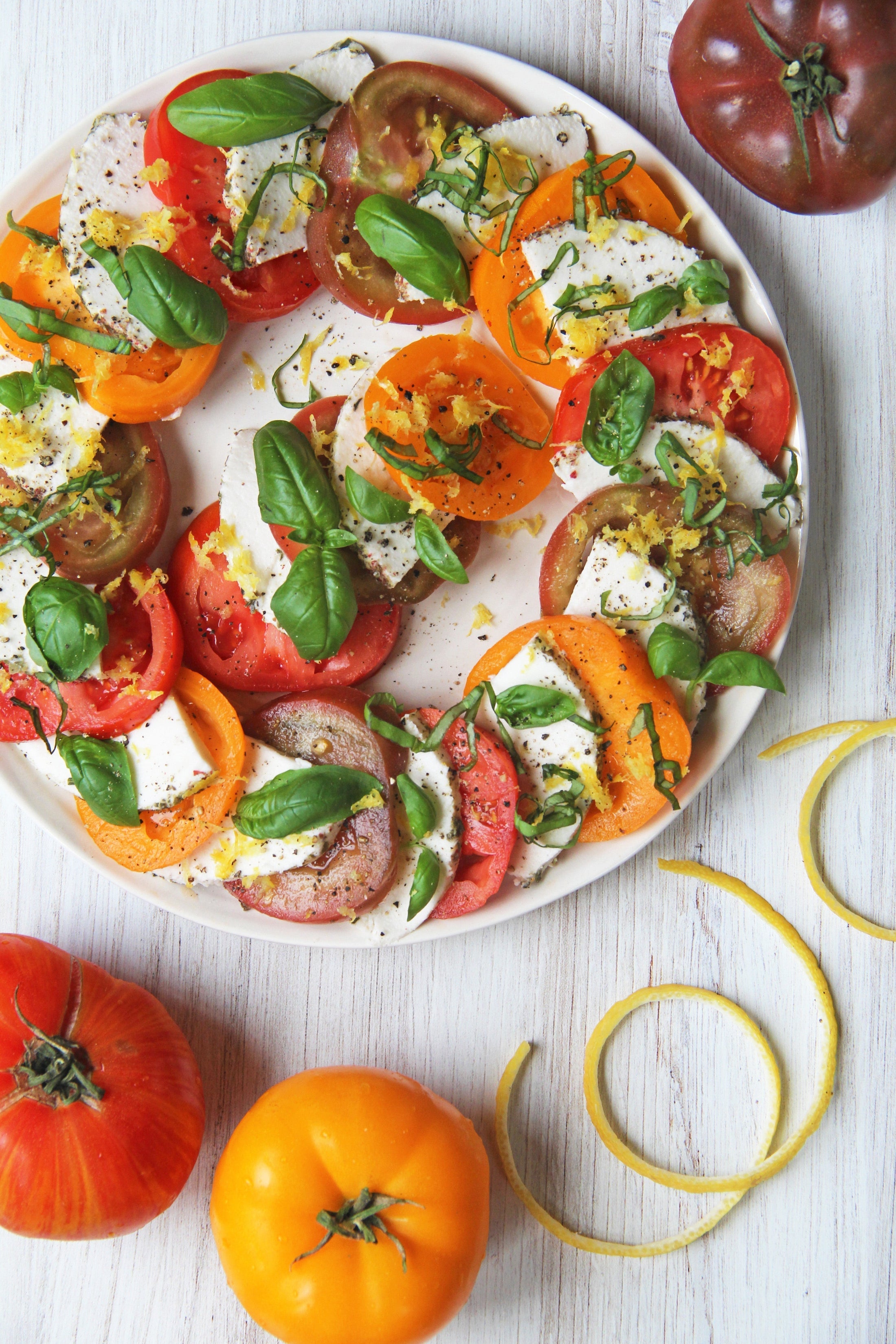 Vegan caprese salad on a white plate
