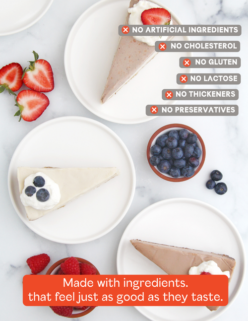 Load image 1 in gallery view. Three vegan cheesecake slices on white plates arranged on a light marble surface, with strawberries, blueberries, and text overlays describing product attributes.