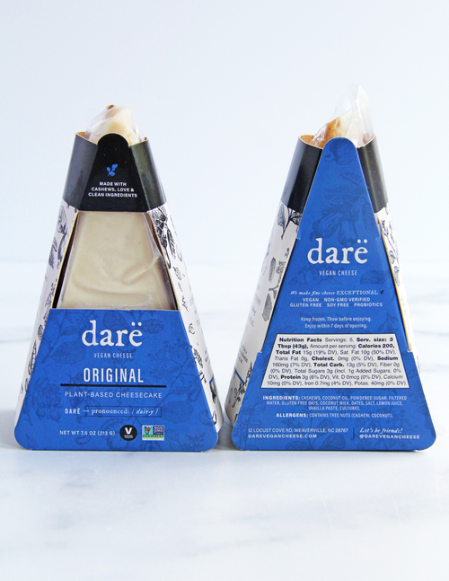Load image 1 in gallery view. Two Dare Vegan Cheese cheesecakes in pyramid packaging, showing both the front and back of the blue and white packaging on a light gray background.