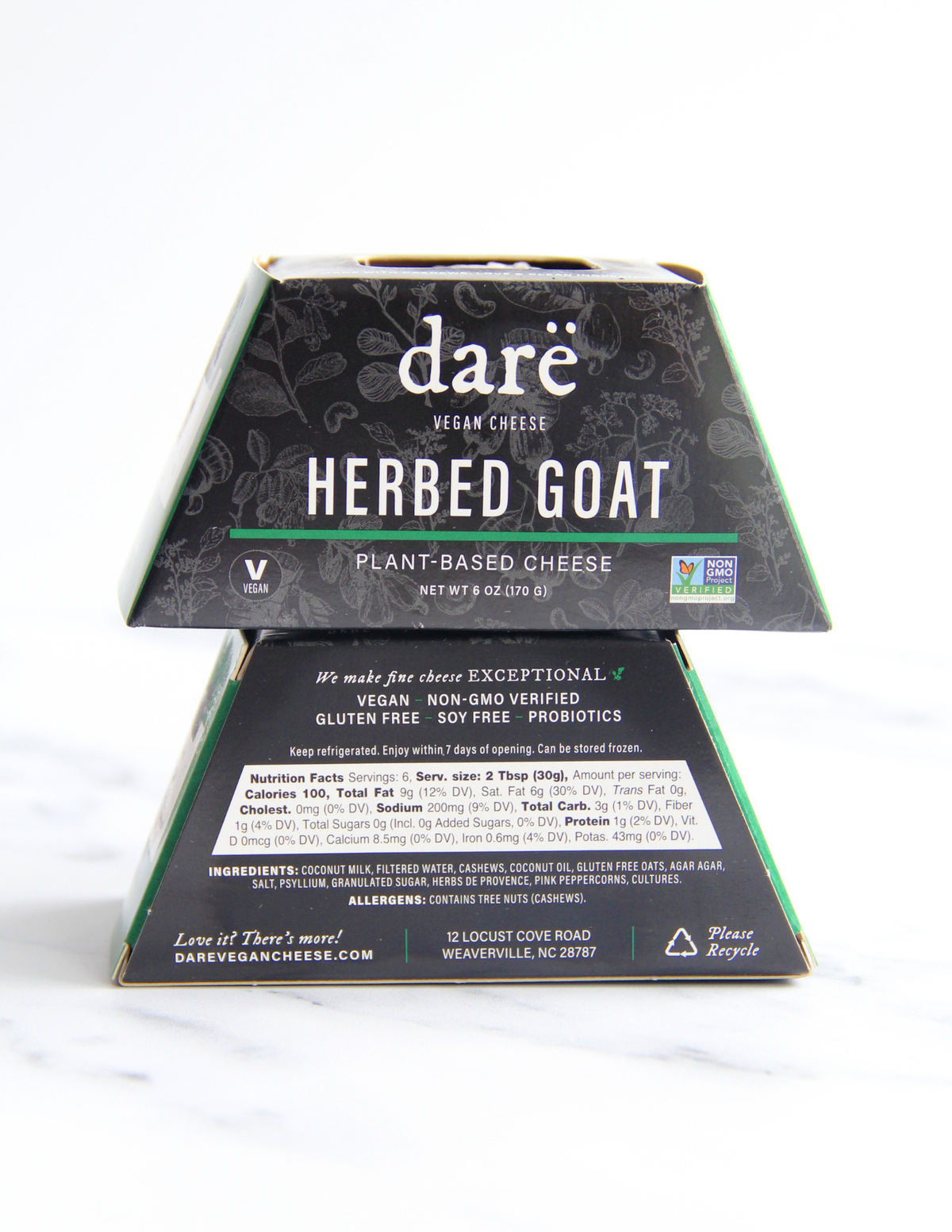 A boxed cheese product from Dare Vegan Cheese, specifically Herbed Goat Plant-Based Cheese, shown on a white marble-like surface with a white background. 