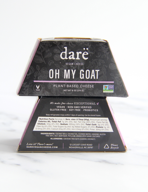 Load image 1 in gallery view. A package of dare vegan cheese 'Oh My Goat' plant-based cheese, shown with its front and back packaging faces visible against a clean white background.