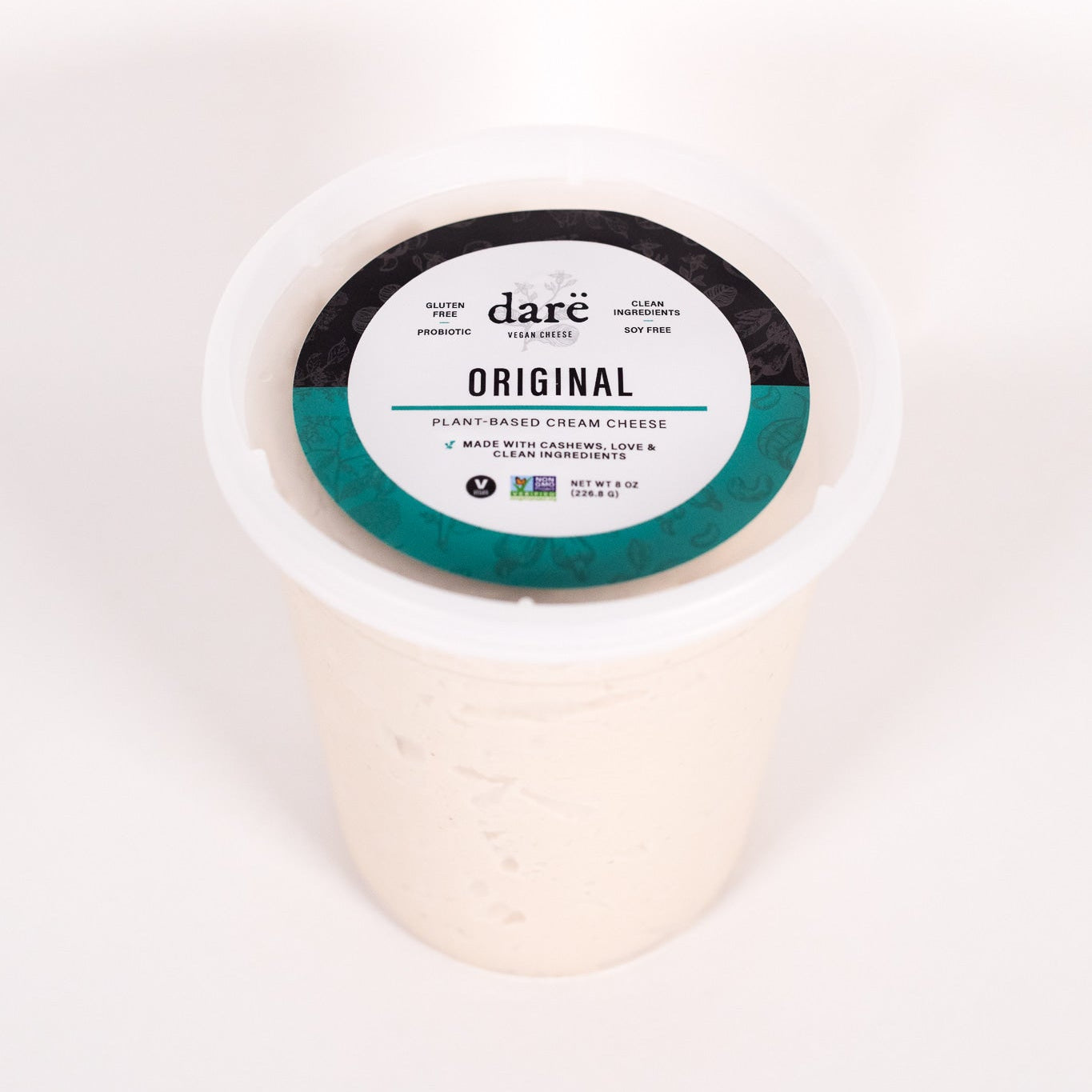 Cream cheese container with 'dare' label on a white background