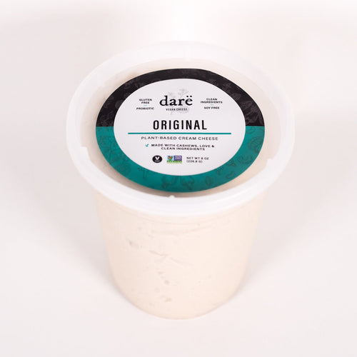 Load image 1 in gallery view. Cream cheese container with 'dare' label on a white background