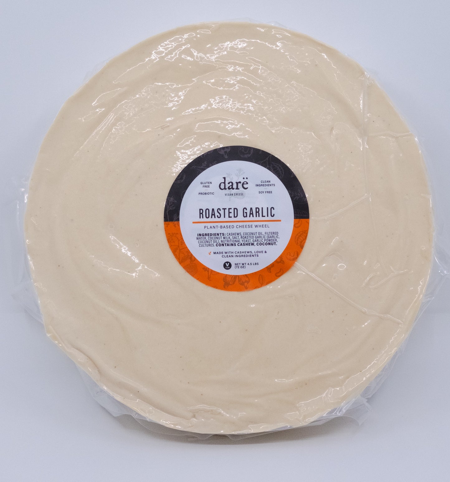 Round package of roasted garlic with a label on a light gray background