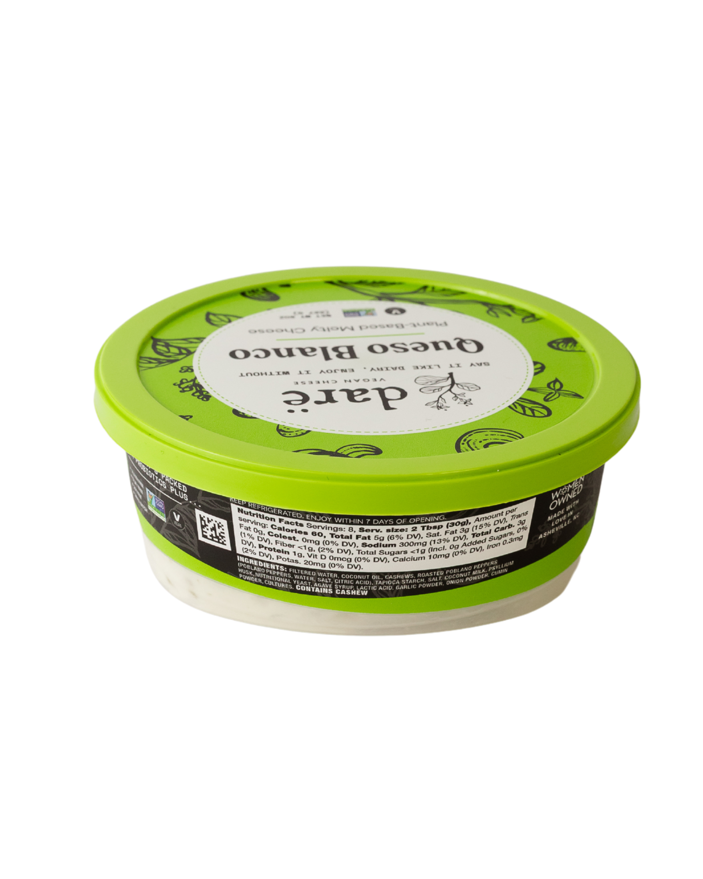 Container of white spread with green lid on a white background