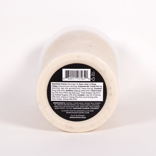 Load image 1 in gallery view. White cylindrical container with a black label on a white background