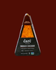 Vegan smoked cheddar wedge packaging with 'dare' branding on a dark background