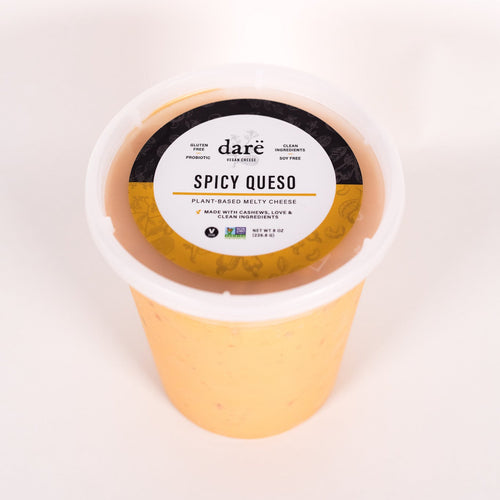Load image 1 in gallery view. Container of 'dare Spicy Queso' on a white background