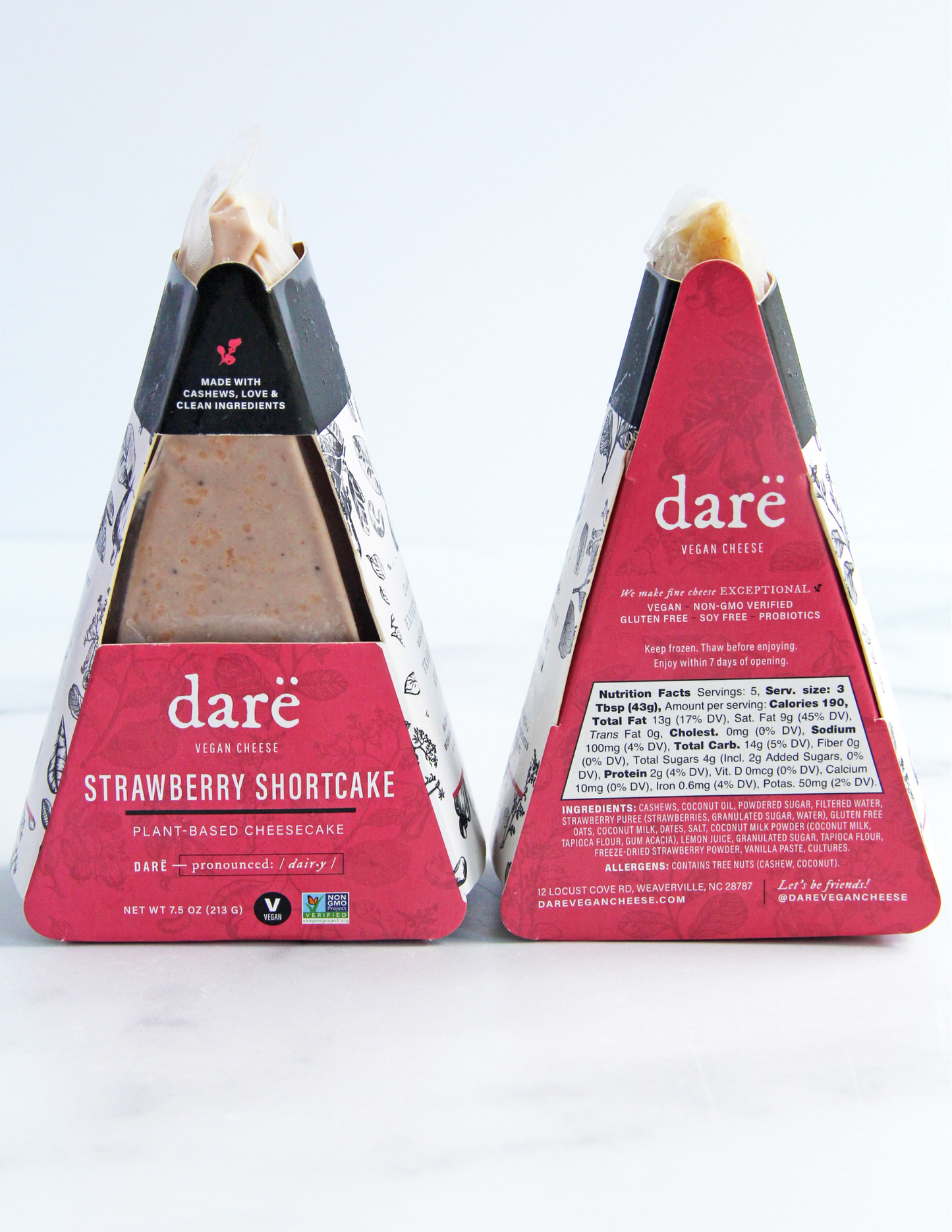 Two packaged dare vegan cheese plant-based cheesecake triangles on a white background, showing the front and back of the packaging for the Strawberry Shortcake flavor.