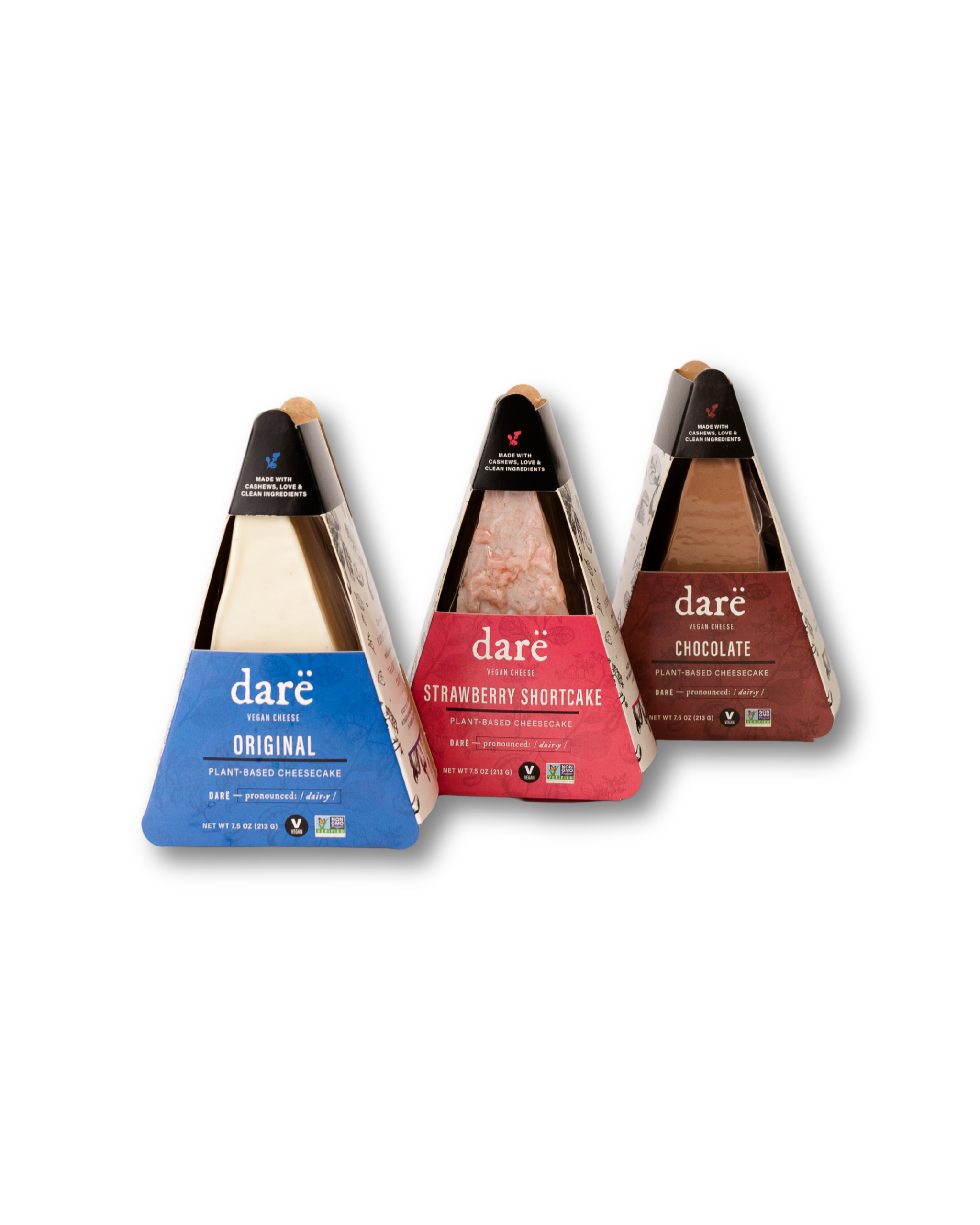 Three triangular packages of dare desserts on a white background