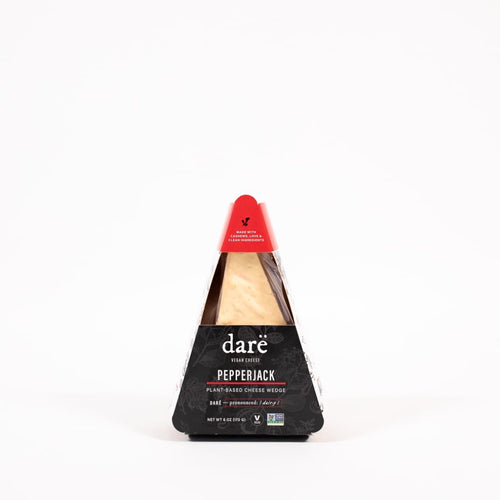 Load image 1 in gallery view. product photo of vegan cheese wedge. black and red paper container. labeled as dare vegan cheese pepperjack