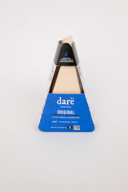 Load image 1 in gallery view. vegan cheesecake desserts product photo on white backdrop. blue and black packaging that reads dare vegan cheese plant-based cheesecake